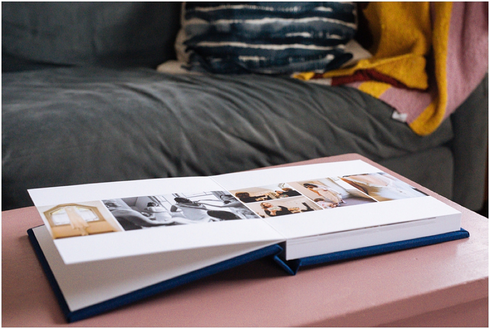 Thick cardstock pages of wedding photography album are shown off as album sits open on pink table