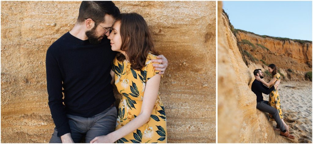 Couple sits together on the red cliffs during their Half Moon Bay engagement photos