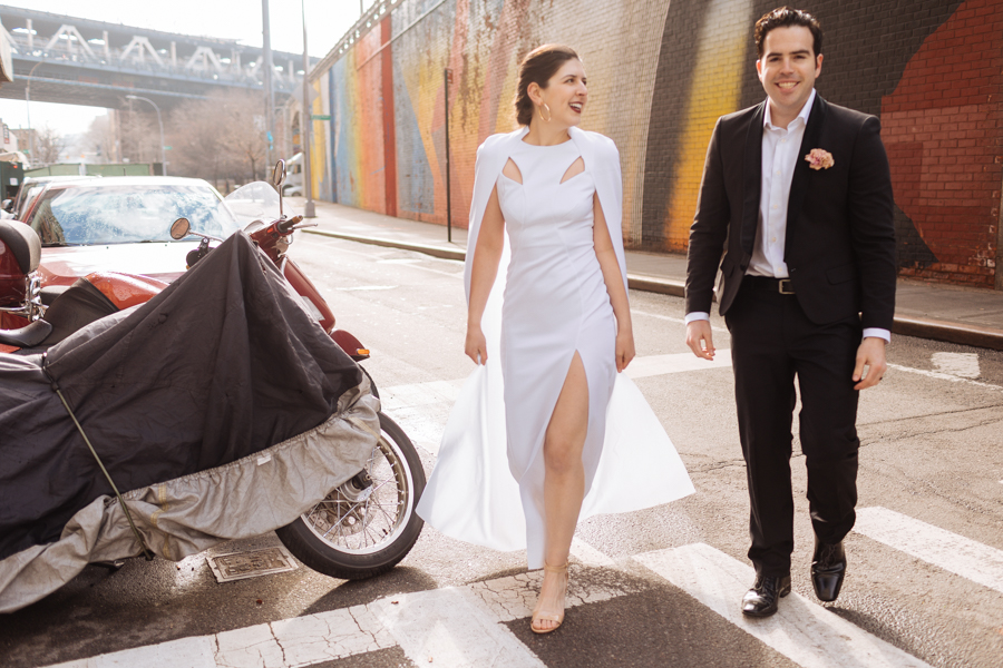 Bride and groom walk across the street like models during their Brooklyn elopement in New York