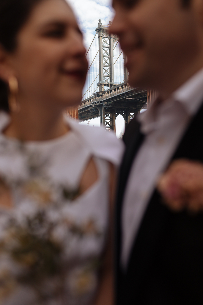 The Manhattan Bridge behind the bride and groom during their Brooklyn elopement