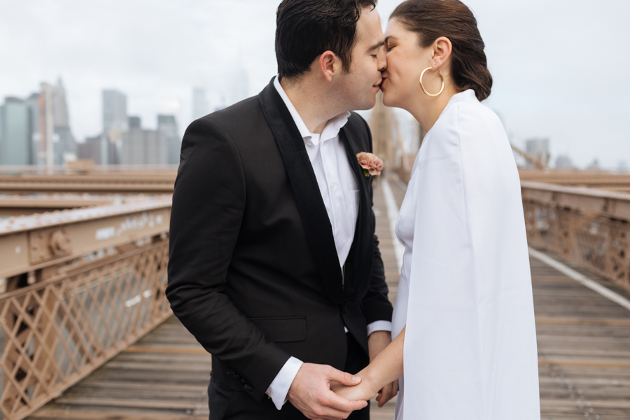 The bride and groom kiss during their Brooklyn elopement in the morning