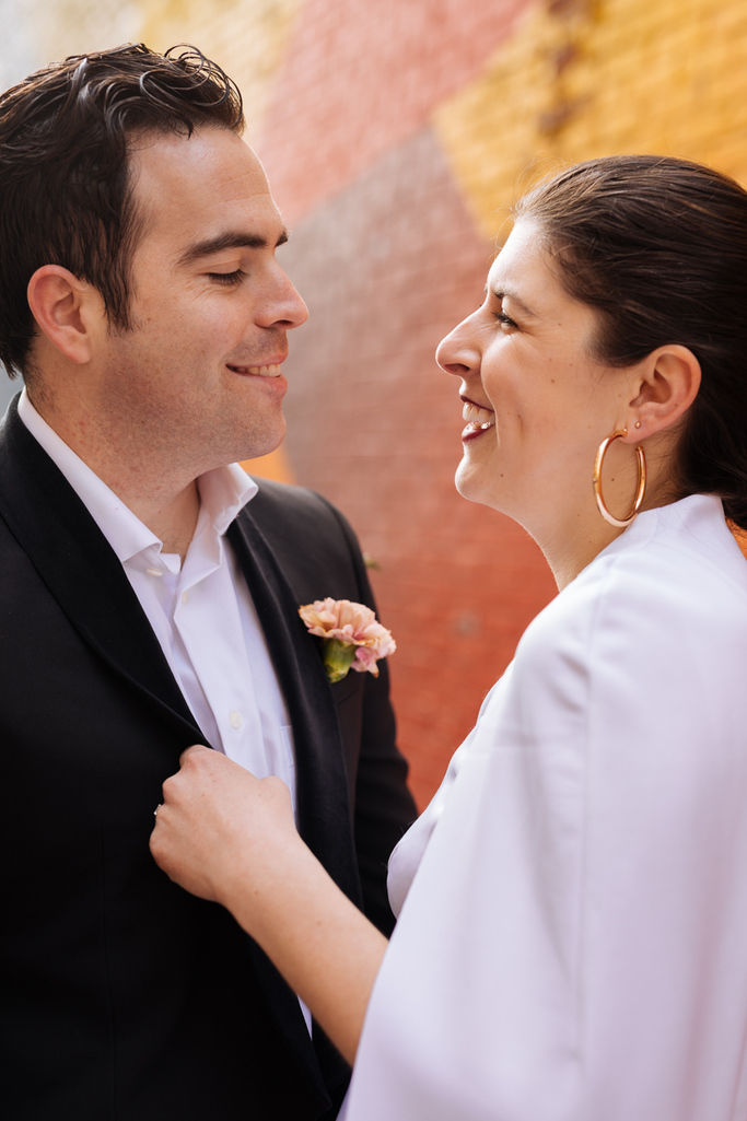 Bride and groom smile at each other during their Brooklyn elopement