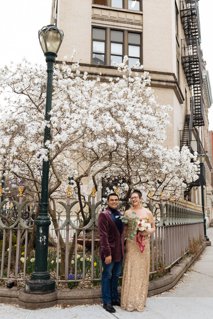 Bride and groom hold hands during their East Village elopement in NYC