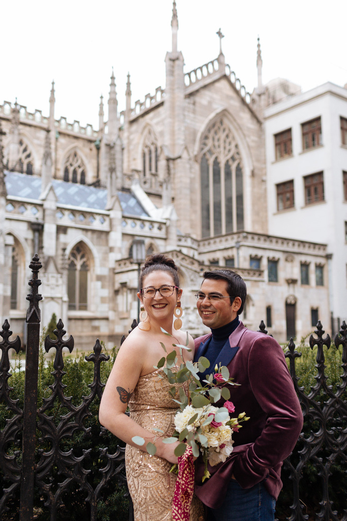 Bride and Groom stand in front of the Grace Church during their East Village elopement in NYC