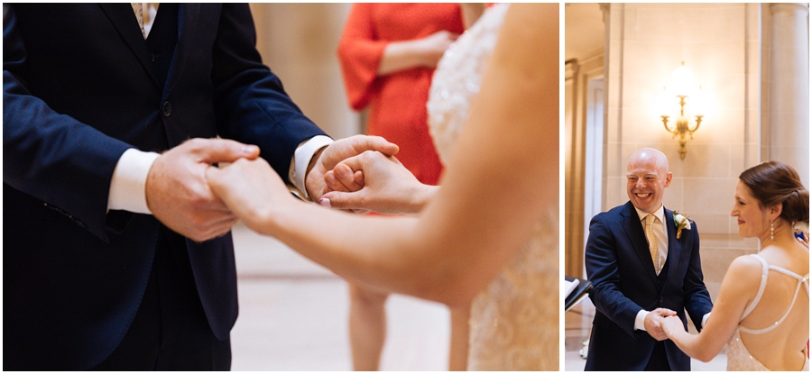 Couple holds hands in the rotunda during their wedding ceremony at their San Francisco City Hall wedding in California