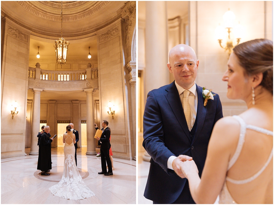 Couple holds hands in the rotunda during their wedding ceremony at their San Francisco City Hall wedding in California