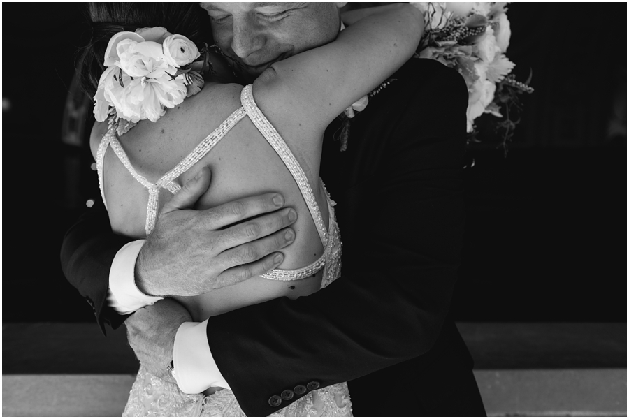 Couple hugs during their San Francisco City Hall wedding in California