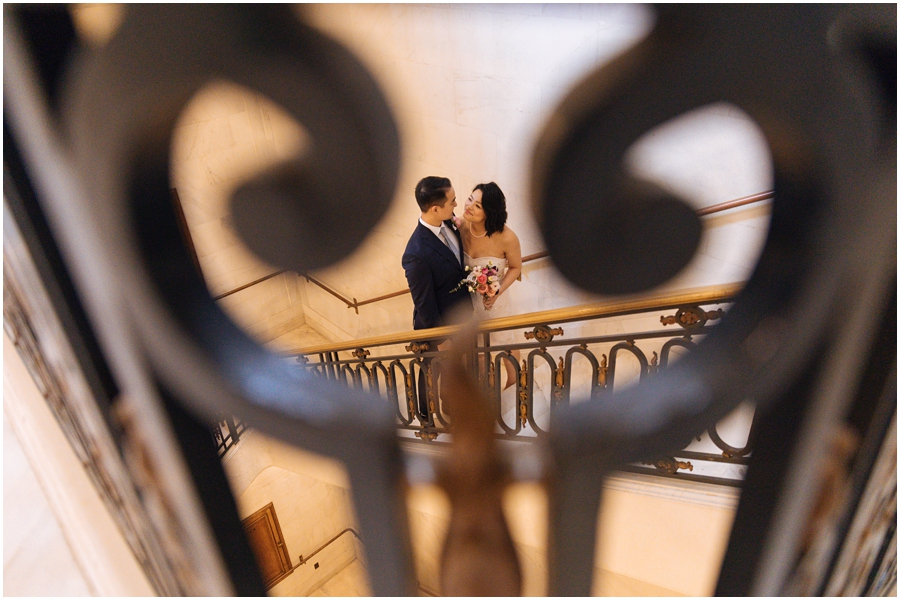 Bride and groom in the stairwell at San Francisco City Hall