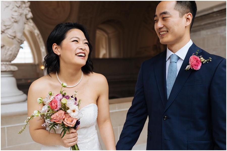 Couple having fun and laughing during their San Francisco City Hall wedding