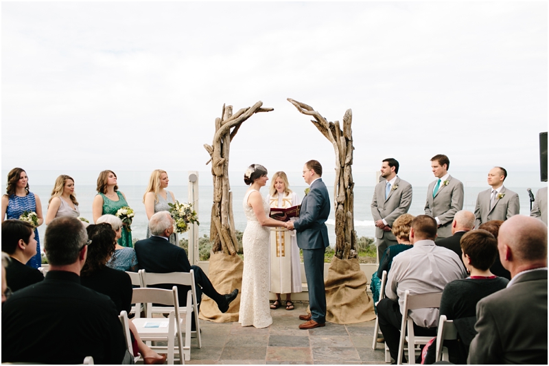 Wedding ceremony on the patio with driftwood ceremony design at Half Moon Bay wedding venue La Costanera