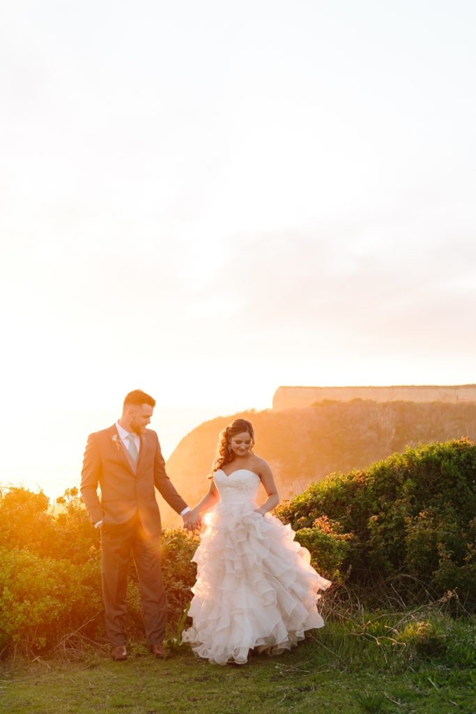 Sunset portraits at a beach overlook nearby during a wedding at the Long Brand Saloon and Farms, Half Moon Bay wedding venue