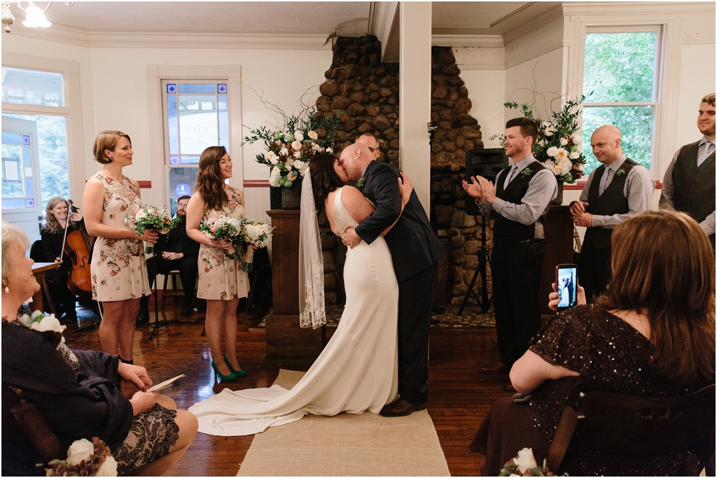 Bride and groom first kiss during their wedding ceremony at Stern Grove