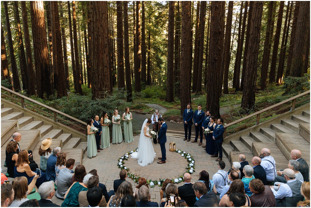 Married couple stands in the redwoods at their redwood wedding venue ceremony site, the Berkeley Botanical Garden, Berkeley